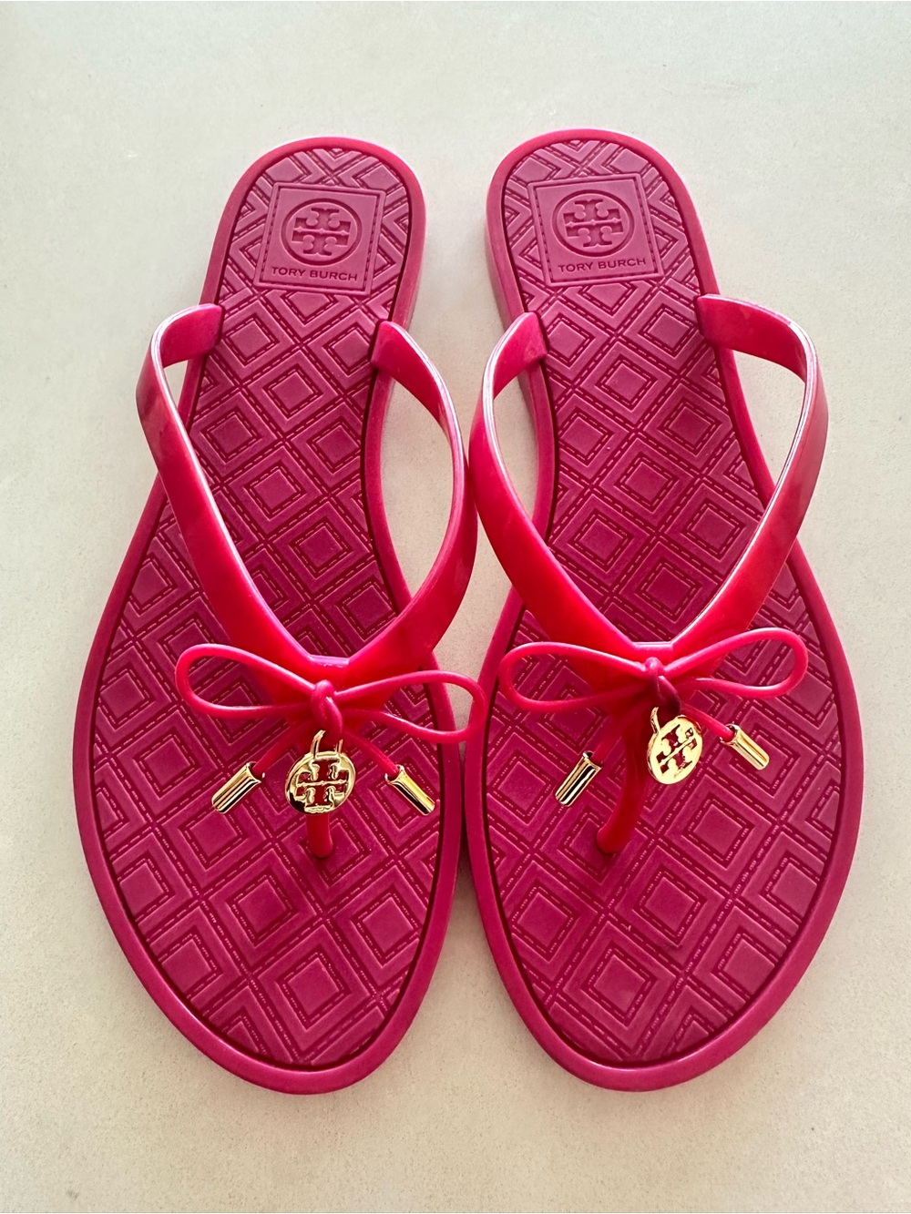 Tory Burch Bright Pink Bow Jelly Sandals with Gold Logo Charm
